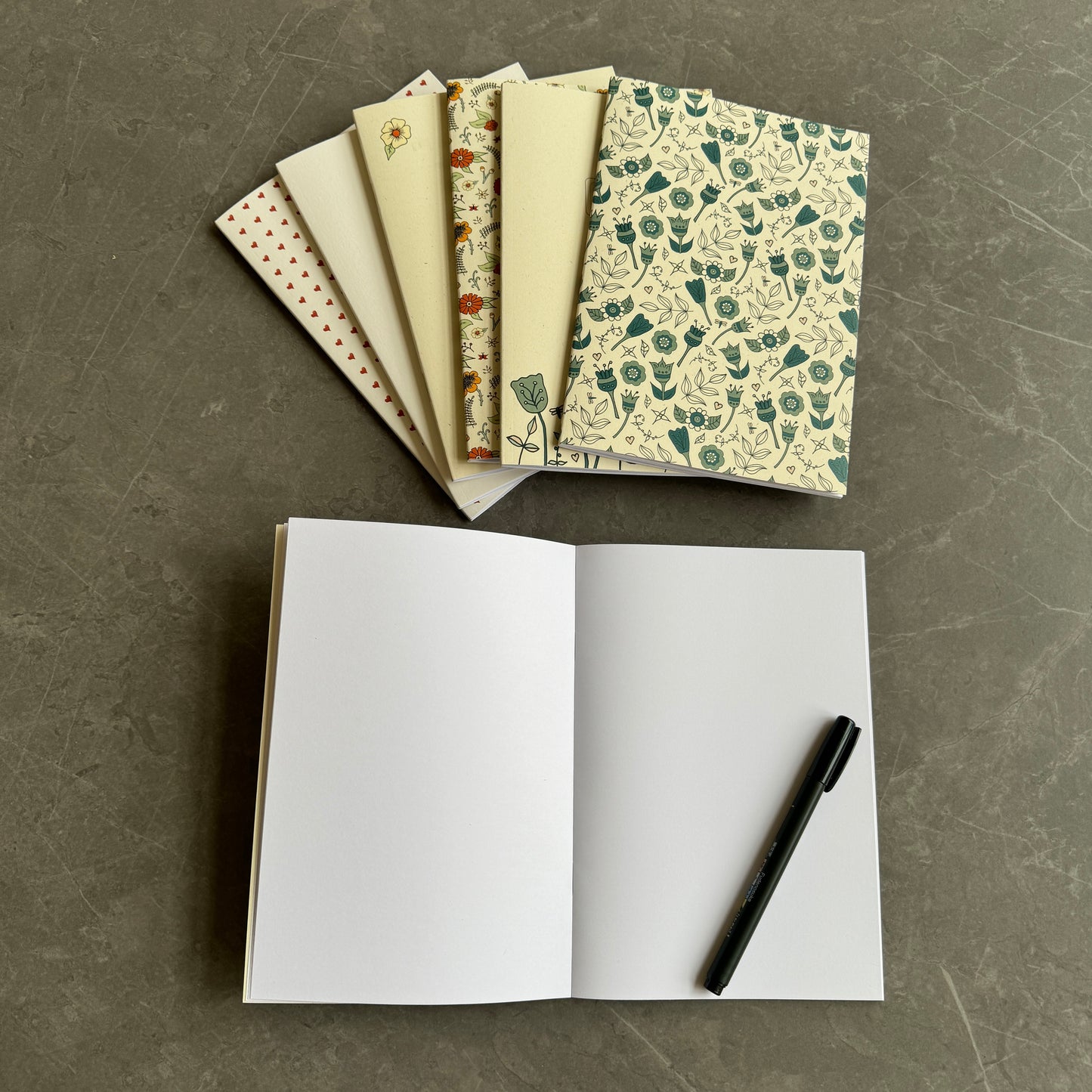 Floral note books in teal