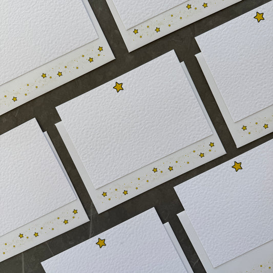 Correspondence cards with small gold star illustration at the top with matching star envelopes